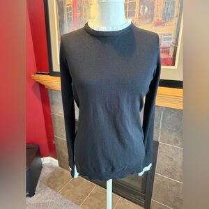 Black sweater with ruffle accents
